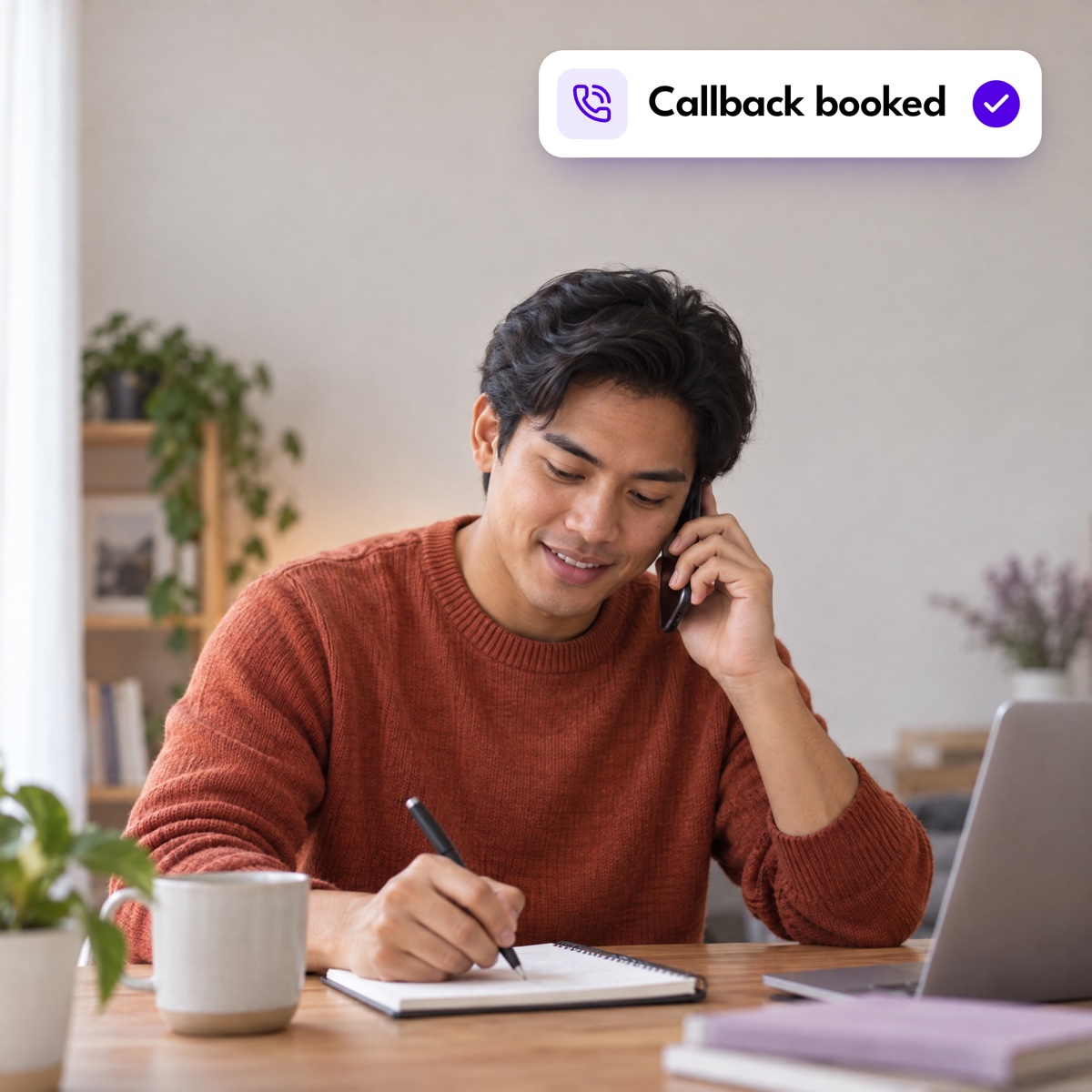 An assistant taking notes during a phone call at his desk, with a "Callback booked" notification